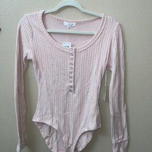 Light pink long sleeve bodysuit, NWT, size M